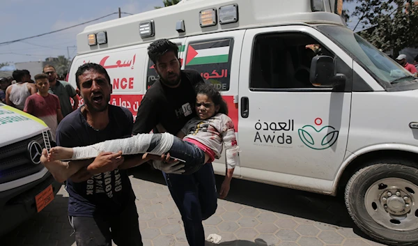 Palestinians wounded in the Israeli bombardment of the Gaza Strip arrive at al-Aqsa Hospital in Deir al Balah on  June 8, 2024.