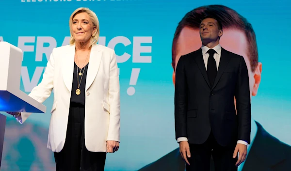 French far-right leader Marine Le Pen and Jordan Bardella, president of the French far-right National Rally, stand at the party election night headquarters, Sunday, June 9, 2024 in Paris (AP)