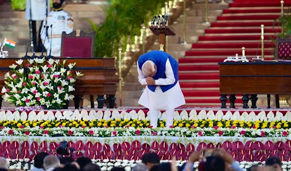 Narendra Modi greets the gathering as he arrives to take oath as the Prime Minister of India at the Rashtrapati Bhawan, in New Delhi, India, Sunday, June 9, 2024 (AP)