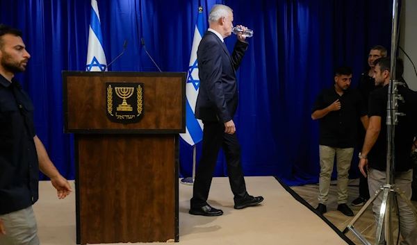 Israeli War Cabinet Benny Gantz as he leaves after announcing his resignation in Ramat Gan, occupied Palestine, June 9, 2024 (AP)