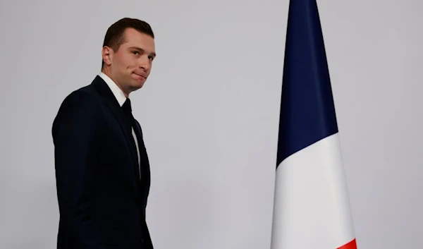 Far-right National Rally party president Jordan Bardella arrives to deliver his speech after the first round vote of the legislative election, Sunday, June 30, 2024 in Paris. (AP)