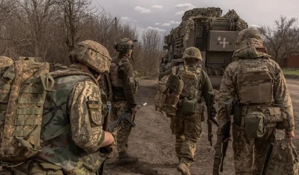 Ukrainian troops on their way towards the front line in Donetsk on 8 Apr 2024 (AFP)