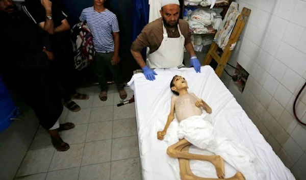 Palestinian child Abdul Qadr al-Sarhi’s lifeless body at the morgue of al-Aqsa Hospital in Deir al-Balah, Gaza on May 31,2024. (Social media)