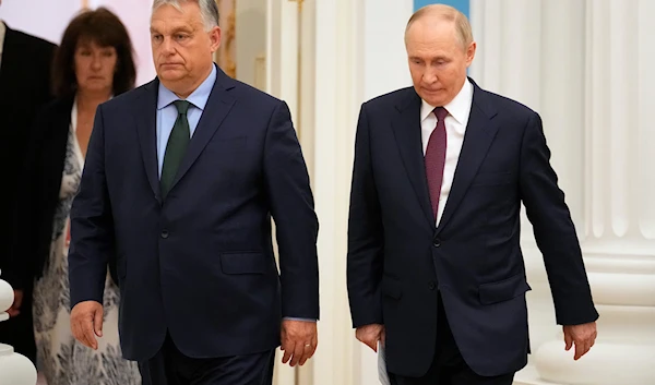 Russian President Vladimir Putin, right, and Hungarian Prime Minister Viktor Orban walk to attend a joint news conference following their talks in the Kremlin in Moscow, Russia, Friday, July 5, 2024. (AP)