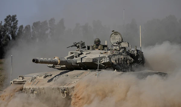 An Israeli tank maneuvers near the Gaza border on July 12, 2024. (AP)