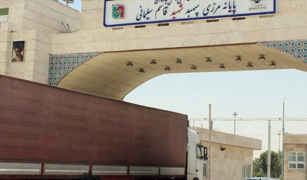 This undated photo published by IRNA shows a truck passing through the Mehran crossing at the Iraq-Iran border. (IRNA)