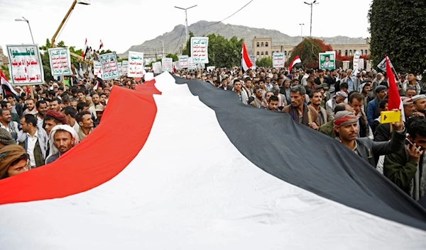 Ansar Allah supporters chant slogans as they attend a rally marking eight years for a Saudi-led coalition, Friday, March 26, 2023, in Sanaa, Yemen. (AP)