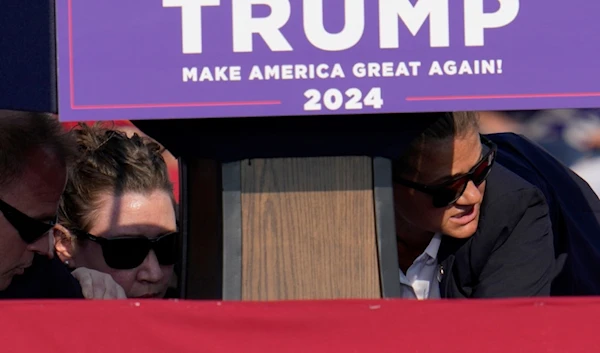 Members of the U.S. Secret Service surround Republican presidential candidate former President Donald Trump at a campaign event in Butler, Pa., US, on Saturday, July 13, 2024. (AP)