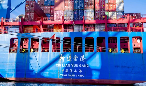 A container ship of Chinese Cosco shipping lies in the harbor in Hamburg, Germany, Wednesday, Oct. 26, 2022. (AP)