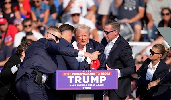 Republican presidential candidate former president Donald trump is helped off stage at campaign event in Pennsylvania on July 13, 202. (AP)