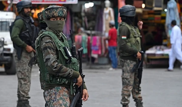 Indian paramilitary troopers stand guard in Srinagar, Kashmir, on August 14, 2023. (AFP)