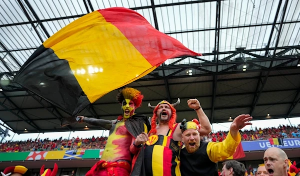 Belgium fans cheer from the stands before a Group E match between Belgium and Romania at the Euro 2024 soccer tournament in Cologne, Germany, Saturday, June 22, 2024. (AP Photo/Andreea Alexandru)