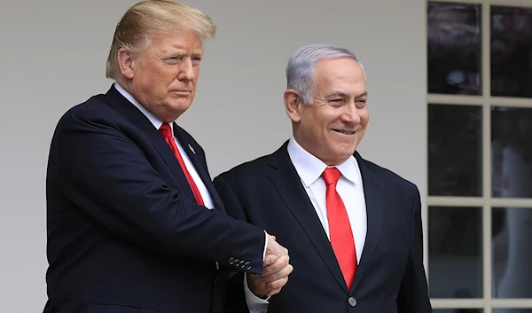 Former US President Donald Trump welcomes Israeli Prime Minister Benjamin Netanyahu to the White House in Washington, March 25, 2019. (AP)