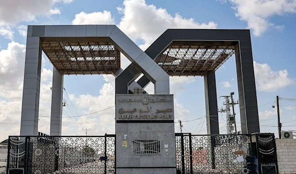 This picture taken on October 19,2023, shows the closed gate to the Rafah border crossing with Egypt, in the southern Gaza Strip. (AFP)