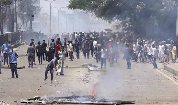 Students clash with riot police during a protest against a quota system for government jobs, in Dhaka, Bangladesh, Thursday, July 18, 2024. (AP)