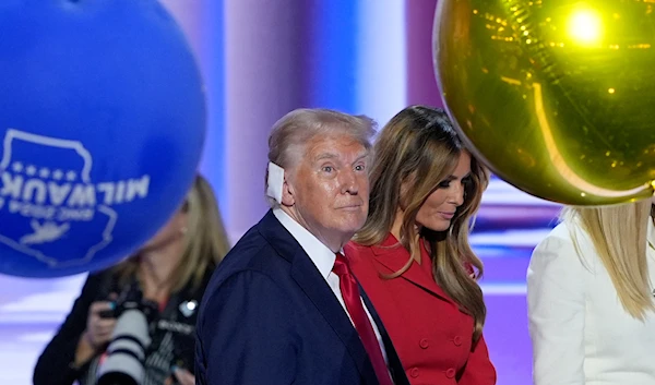 Republican presidential candidate former President Donald Trump, walking on stage with former first lady Melania Trump at the end of the Republican National Convention (RNC), July 18, 2024, in Milwaukee (AP)