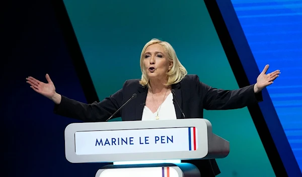 French far-right leader Marine Le Pen delivers a speech during a campaign rally, on February 5, 2022. (AP)