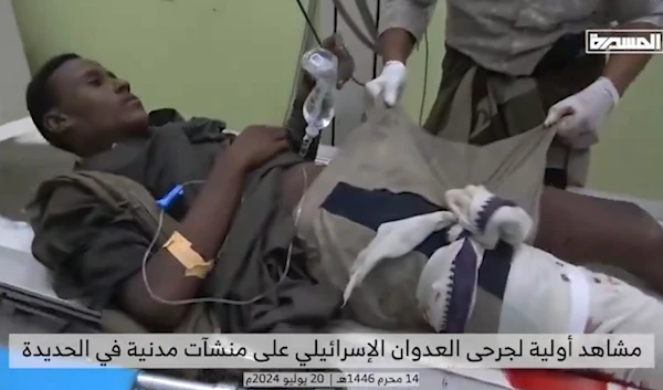 A Yemeni civilian is pictured with a bloodied leg at a hospital near Hodeidah. (Screengrab from Al Masira)