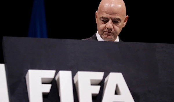 FIFA President Gianni Infantino walks on the stage before the start of the 69th FIFA congress in Paris, June 5, 2019 (AP)