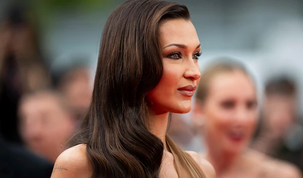 Bella Hadid poses for photographers upon arrival at the premiere of the film 'The Apprentice' at the 77th International Film Festival, Cannes, southern France, May 20, 2024 (Invision via AP)