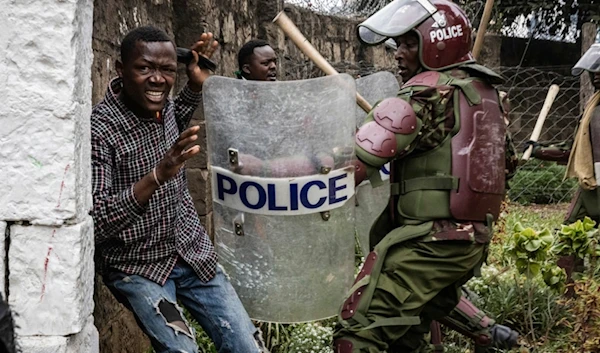 Protesters are detained by riot policemen during protests accusing the president of poor governance and calling for his resignation, in Nairobi, Kenya, July 16, 2024. (AP)