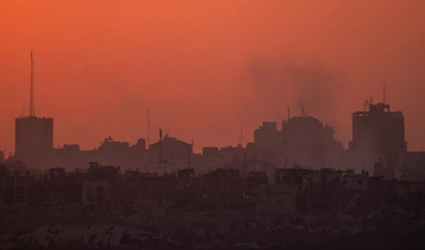 Destroyed buildings stand in the Gaza Strip during the sunset, Wednesday, July 17, 2024. (AP Photo/Leo Correa)