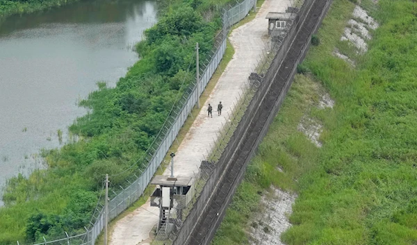 South Korean army soldiers patrol along the barbed-wire fence in Paju, South Korea, near the border with North Korea, Sunday, July 21, 2024. (AP)