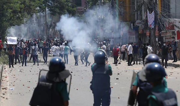 Students clash with riot police during a protest against a quota system for government jobs, in Dhaka, Bangladesh, Thursday, July 18, 2024. (AP)