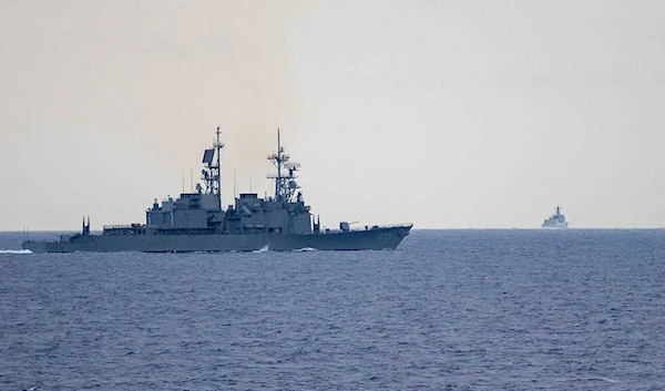 Taiwan guided missile destroyer Ma Kong DDG1805, left, monitors Chinese guided missile destroyer Xi'an DDG15, right, near Taiwan on Thursday, May 23, 2024. (Taiwan Ministry of National Defense/AP)