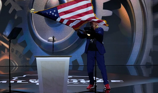 Hulk Hogan waving US flag while on stage during the Republican National Convention on Thursday, July 18, 2024, in Milwaukee. (AP)