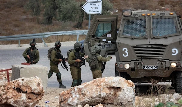 Israeli occupation soldiers near the West Bank city of Tulkarm where two Palestinians were reportedly killed by Israeli forces on October 5, 2023. (AFP)