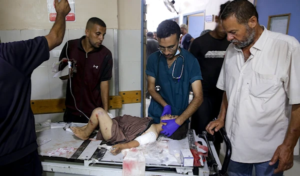 A Palestinian boy wounded in the Israeli bombardment of the Gaza Strip is treated in a hospital in Khan Younis, on July 9, 2024. (AP)