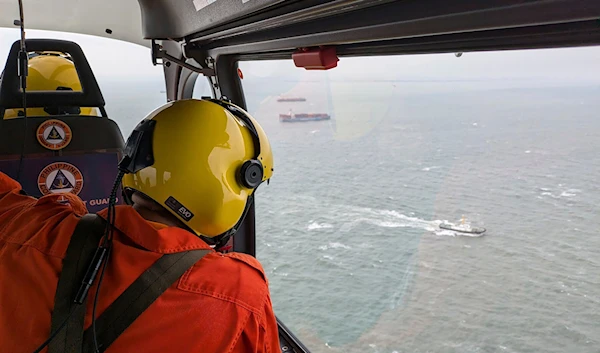 In this photo provided by the Philippine Coast Guard, an aerial survey is conducted by Coast Guard Aviation Command as part of the oil spill response operation in Manila Bay, Philippines, July 25, 2024 (AP)