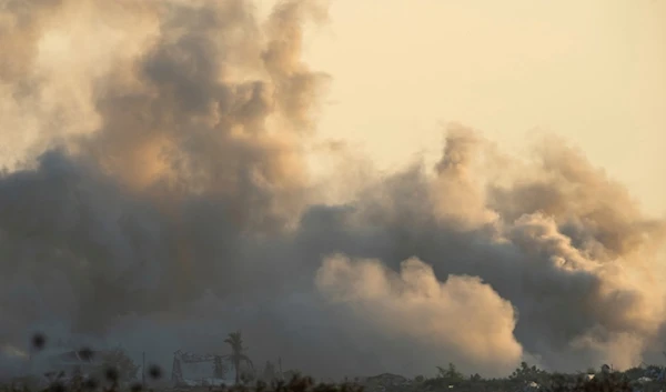 Smoke rises following an Israeli attack in the Gaza Strip as seen from southern occupied Palestine, Tuesday, July 23, 2024. (AP)