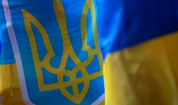 Demonstrators hold Ukrainian flags during a protest against the war outside the Russian embassy in Lisbon, Thursday, July 11, 2024. (AP)