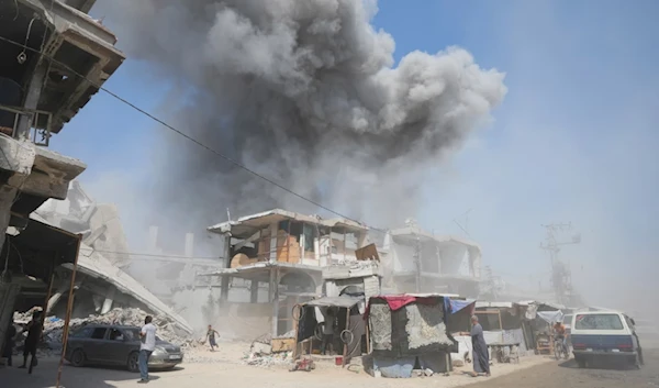 Smoke rises from buildings in Khan Younis after an Israeli airstrike on July 25, 2024. (AP)