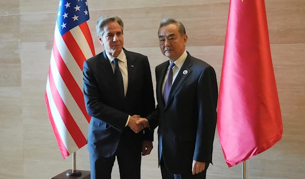 US Secretary of State Antony Blinken, left, shakes hands with Chinese counterpart Wang Yi on the sideline of the Association of Southeast Asian Nations (ASEAN) Foreign Ministers' Meeting in Vientiane, Laos, July 27, 2024 (AP)