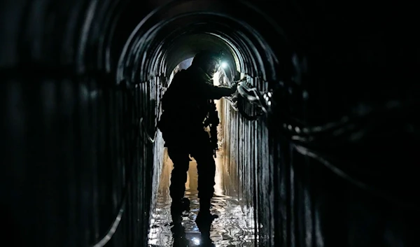 Israeli soldier walks in an electrical chamber underneath a UNRWA compound, alleged to have been used by Hamas in Gaza, Thursday, Feb. 8, 2024. (AP)