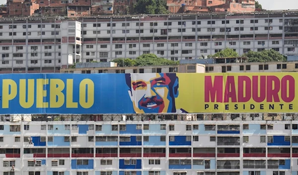 A campaign banner promotes President Nicolas Maduro in Caracas, Venezuela, Saturday, July 27, 2024. (AP)