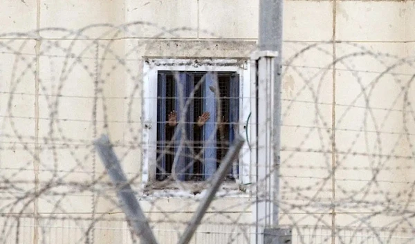 Prisoners seen through barbed wires from an Israeli prison, November 9, 2018.(AFP)