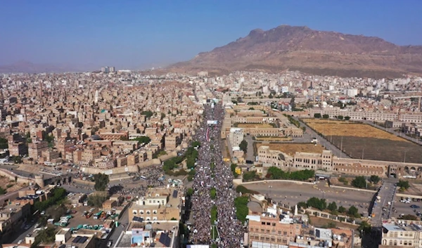 Ansar Allah supporters attend a rally marking the seventh anniversary of the Saudi-led coalition's intervention in Yemen's war, in Sanaa, Yemen, March 26, 2022.