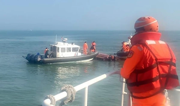 Illustrative: In this photo distributed by the Taiwanese Coast Guard, guards inspect a vessel that capsized during a chase off the coast of the Kinmen Archipelago in Taiwan on February 14,2024. (AP)