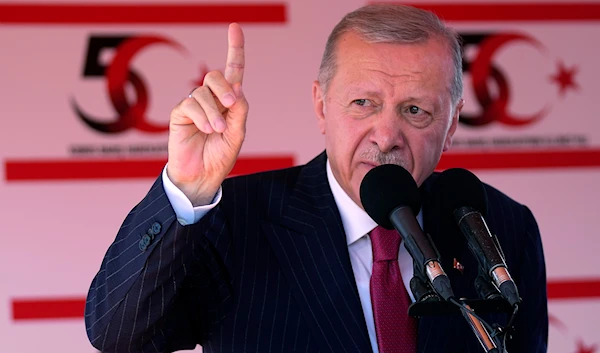 Turkish President Recep Tayyip Erdogan talks during a military parade in Nicosia on Saturday, July 20, 2024. (AP)