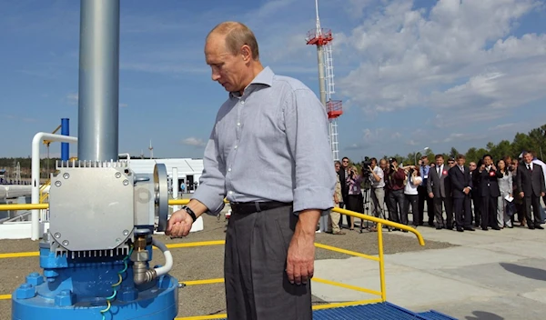 Vladimir Putin opens a throttle for the Russia-China oil pipeline, undated. (AFP)