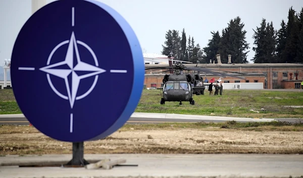 Military helicopters are parked at an airbase in Kocuve, about 85 kilometers (52 miles) south of Tirana, Albania, Monday, March 4, 2024. (AP)