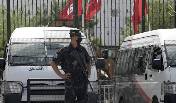 A police officer stands guard outside the parliament building in Tunis, undated. (AFP)