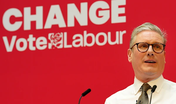 Britain's Labour Party leader Keir Starmer speaks on stage at the launch of the party's manifesto in Manchester, England, Thursday, June 13, 2024. (AP)