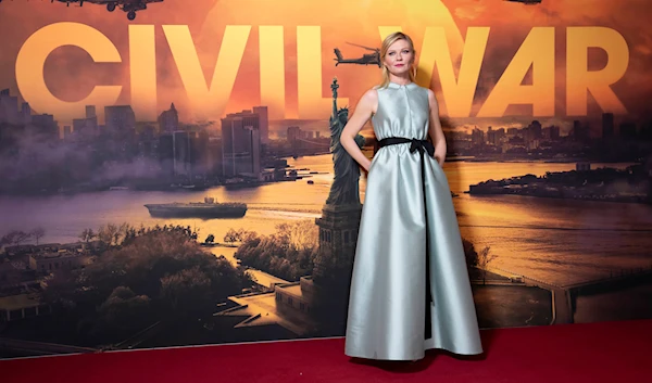 Kirsten Dunst poses for photographers on arrival at the special screening of the film 'Civil War' in London, on Tuesday, March 26, 2024. (AP)