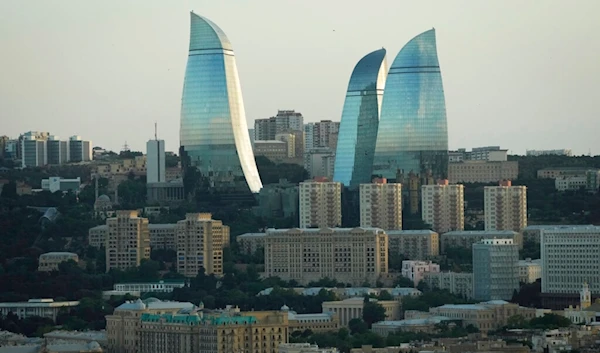 A general view of the city with the Flame Towers skyscrapers in background in Baku, Azerbaijan, Thursday, June 9, 2022. (AP)