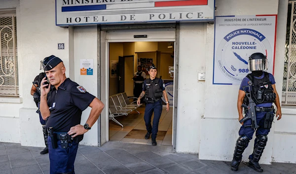 Police wait for the arrival of French President Emmanuel Macron at the central police station in Noumea, New Caledonia, Thursday, May 23, 2024. (AP)